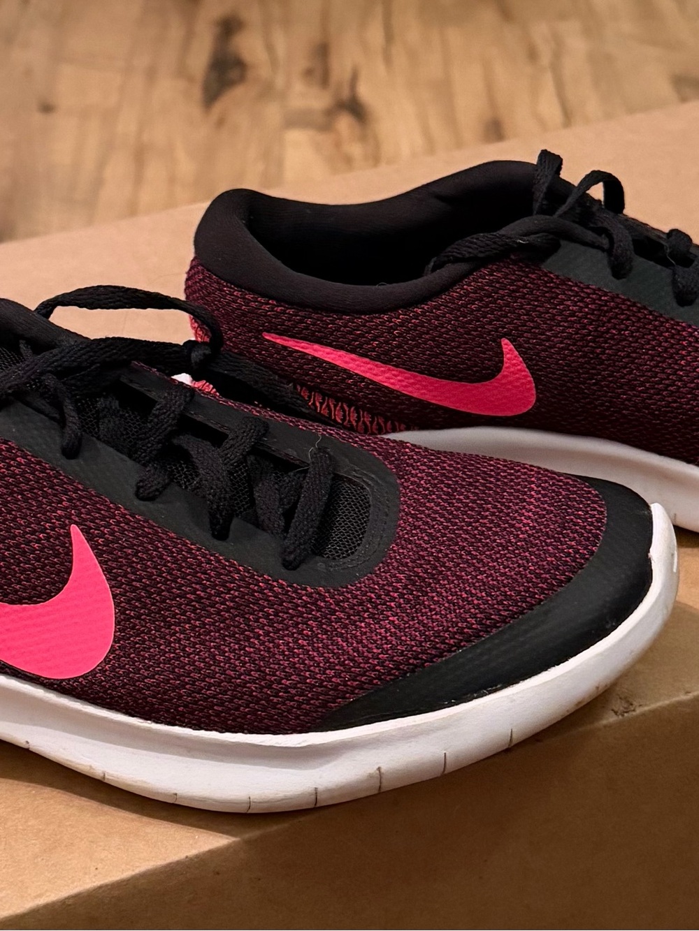 Nike Women’s Athletic Shoe in black and with Pink Swoosh